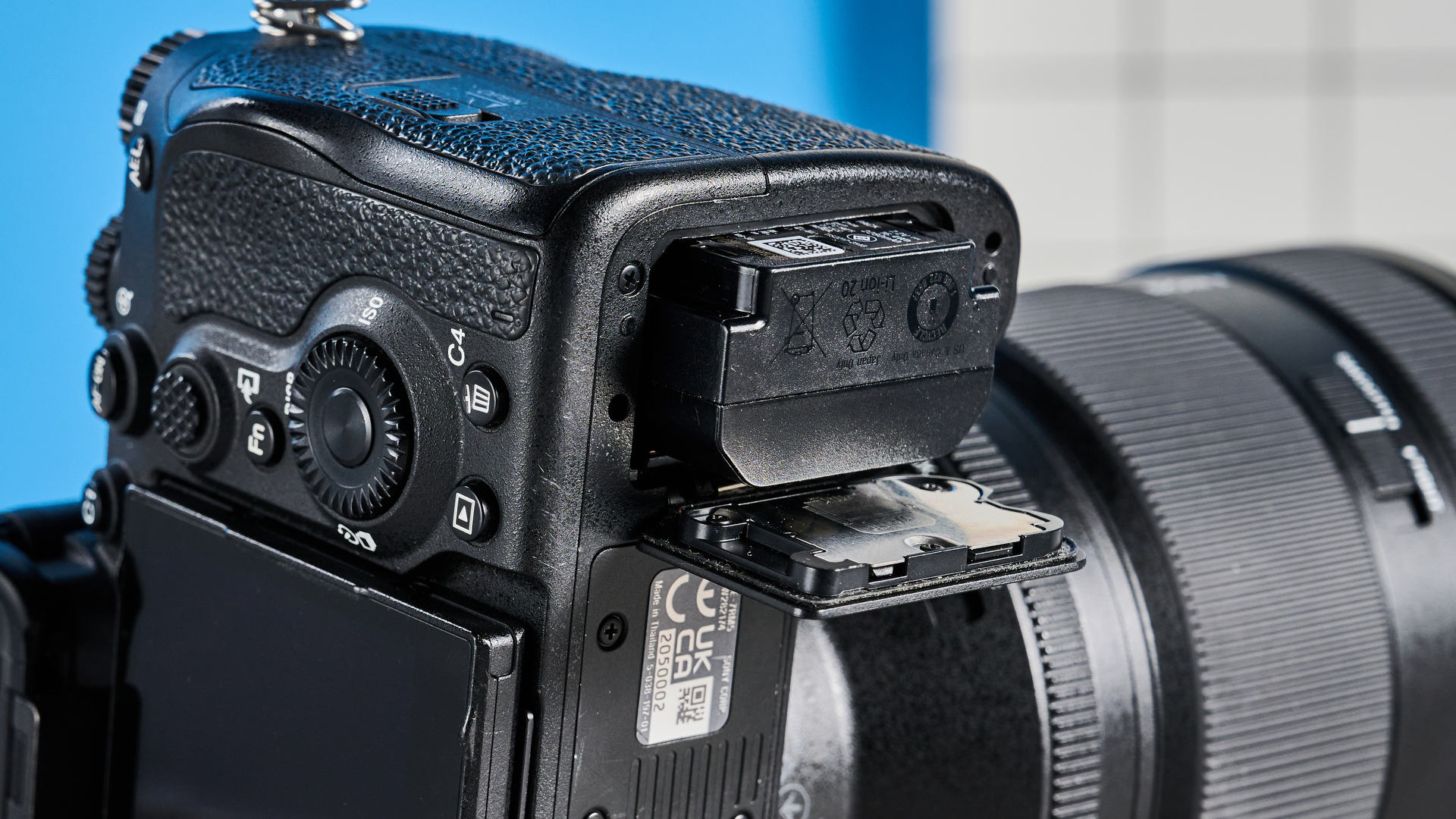 The Sony A7R V with its battery port open