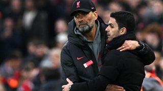 Liverpool's German manager Jurgen Klopp (L) embraces Arsenal's Spanish manager Mikel Arteta after the English Premier League football match between Liverpool and Arsenal at Anfield in Liverpool, north west England on April 9, 2023.