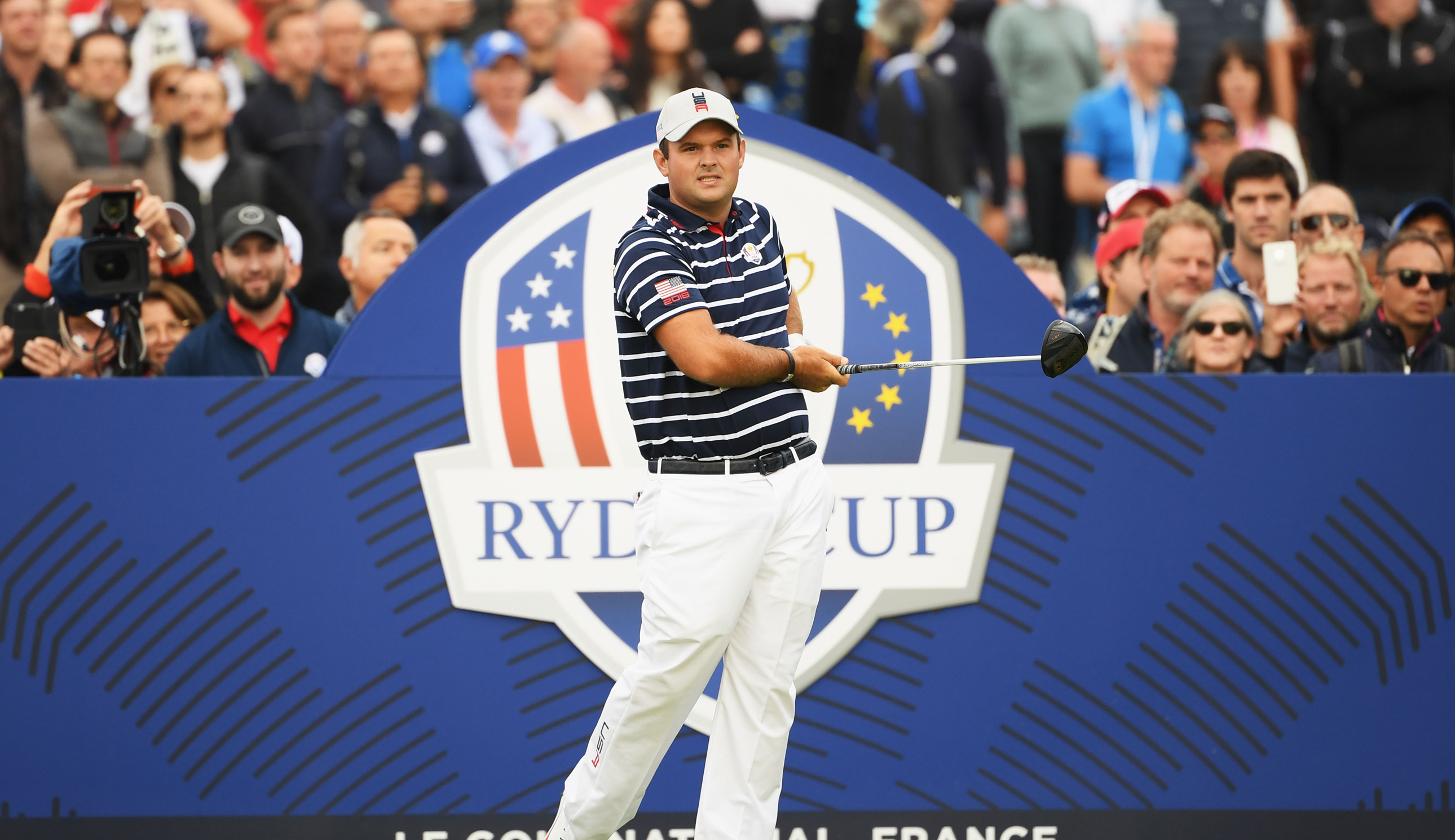Patrick Reed hits a tee shot at the Ryder Cup