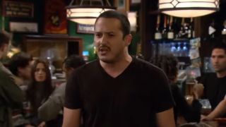 Carl the bartender in a black t-shirt on How I Met Your Mother