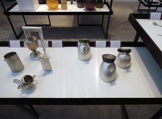 Silverware made of silver and lava rock displayed on table
