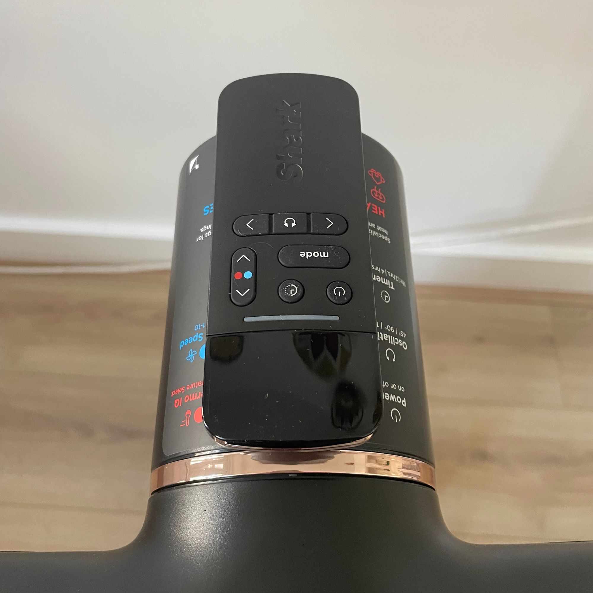 Close up of the remote control on top of the Shark TurboBlade Cool + Heat TH200UK