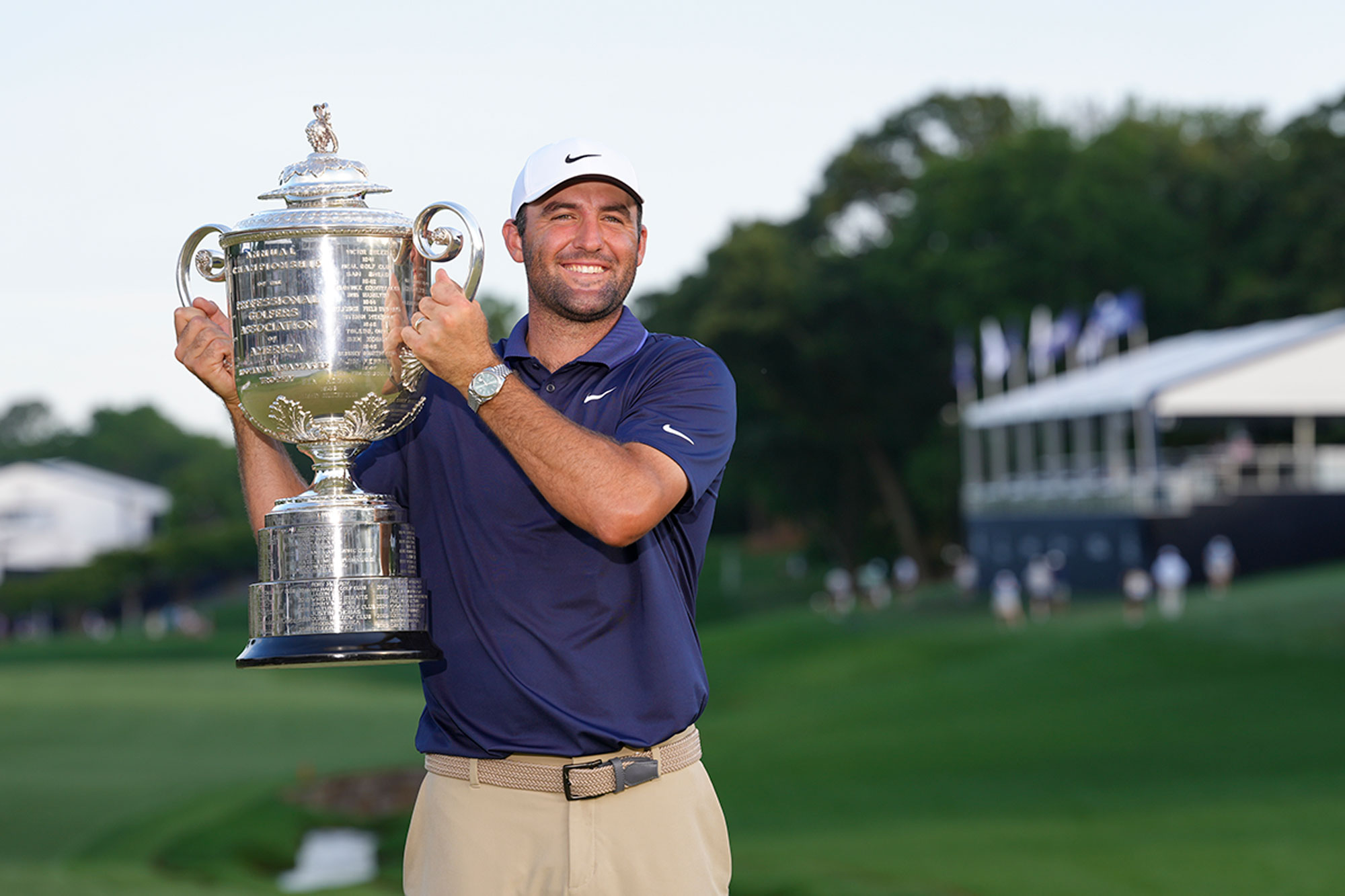 Scottie Scheffler holding the Wanamaker Trophy after winning the PGA Championship at Quail Hollow in 2025