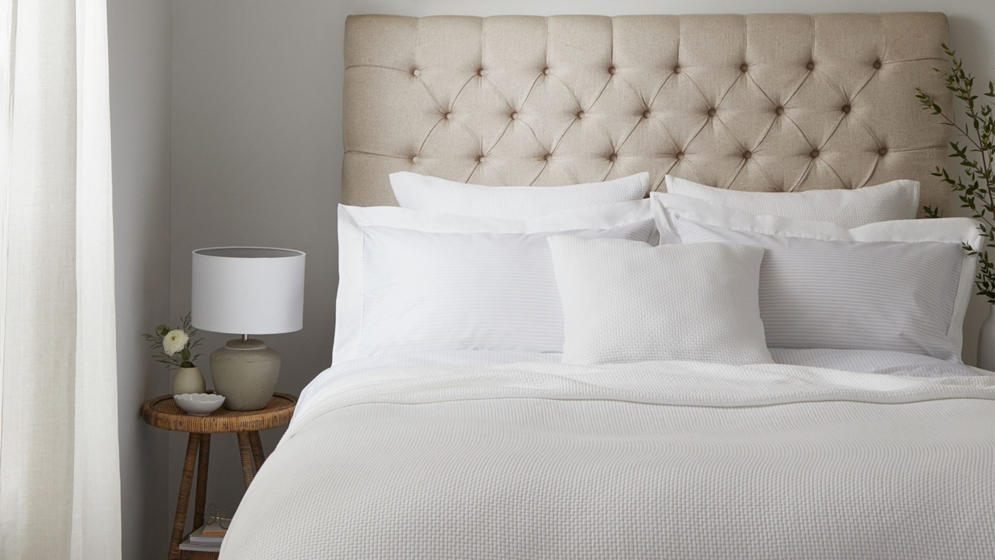 The White Company textured Colville Bedspread on bed frame in neutral bedroom