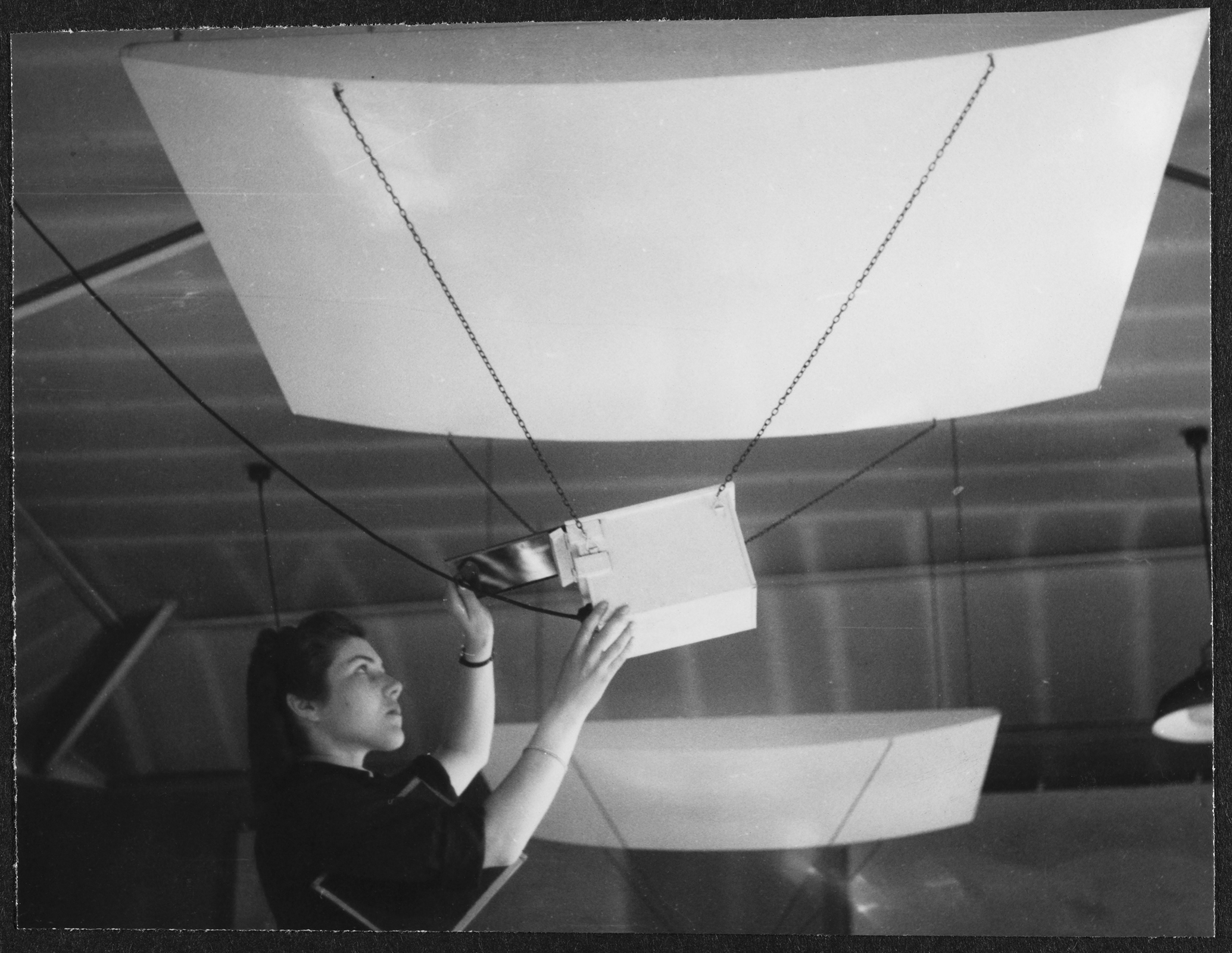 A Women's Auxiliary Air Force (WAAF) trainee preparing safelights prior to printing, during training at the No.2 School of Photography in Blackpool