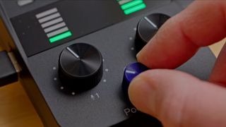 someone turning the dial on the Zoom PodTrak P2 interface