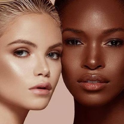 Two women close up, wearing glowy makeup.
