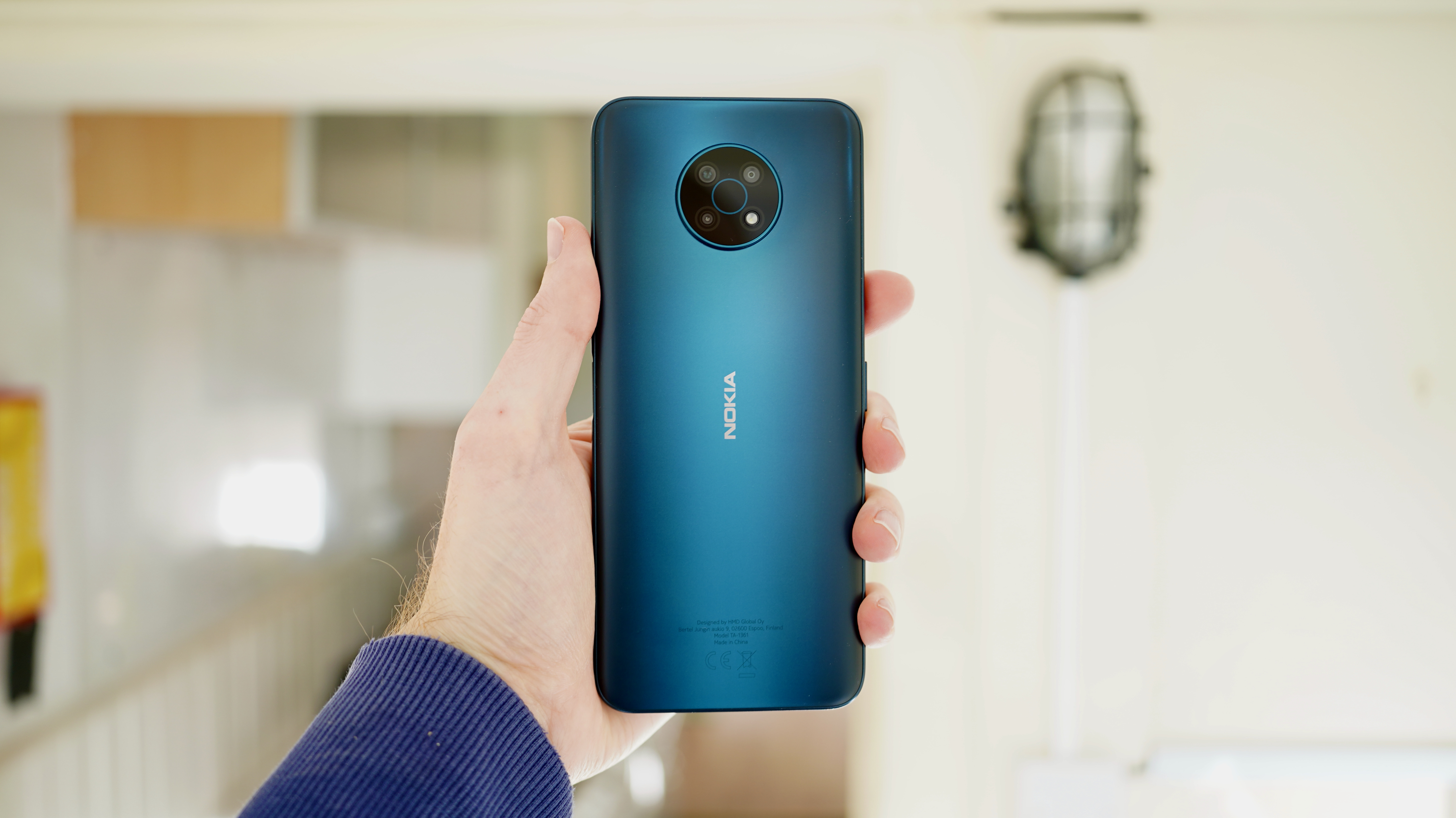 A photo of the Nokia G50 in blue, held in someone's hand
