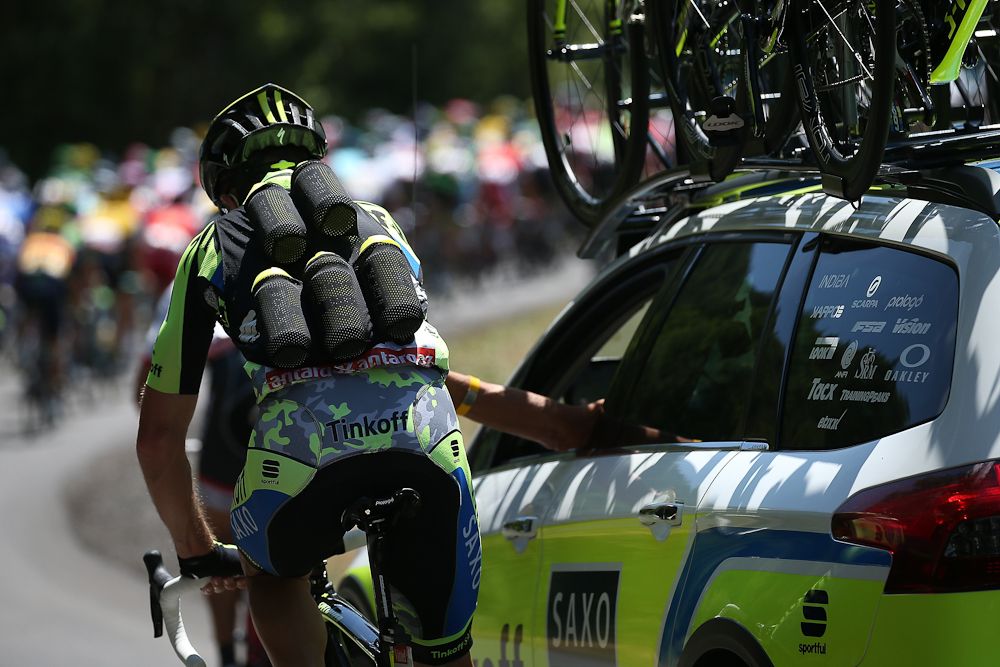 The Tinkoff-Saxo water bottle vest gets a workout.
