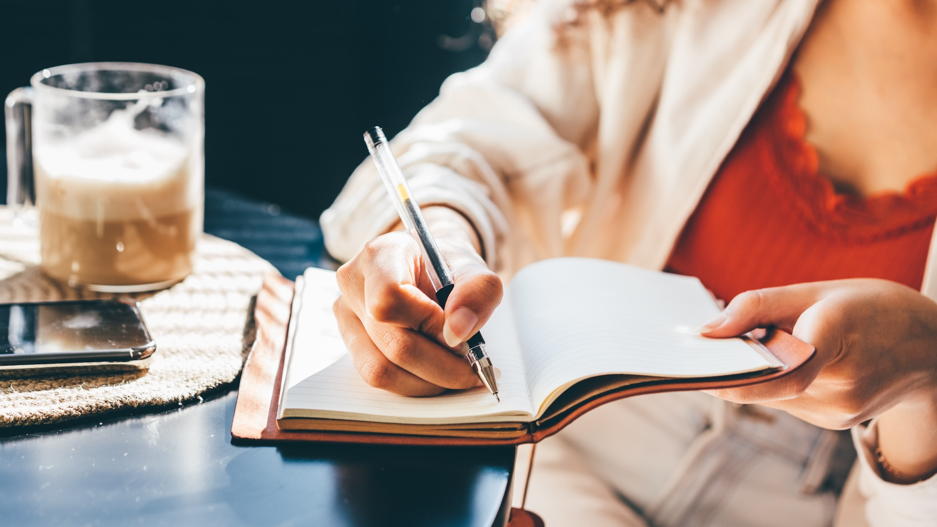 woman writing in journal
