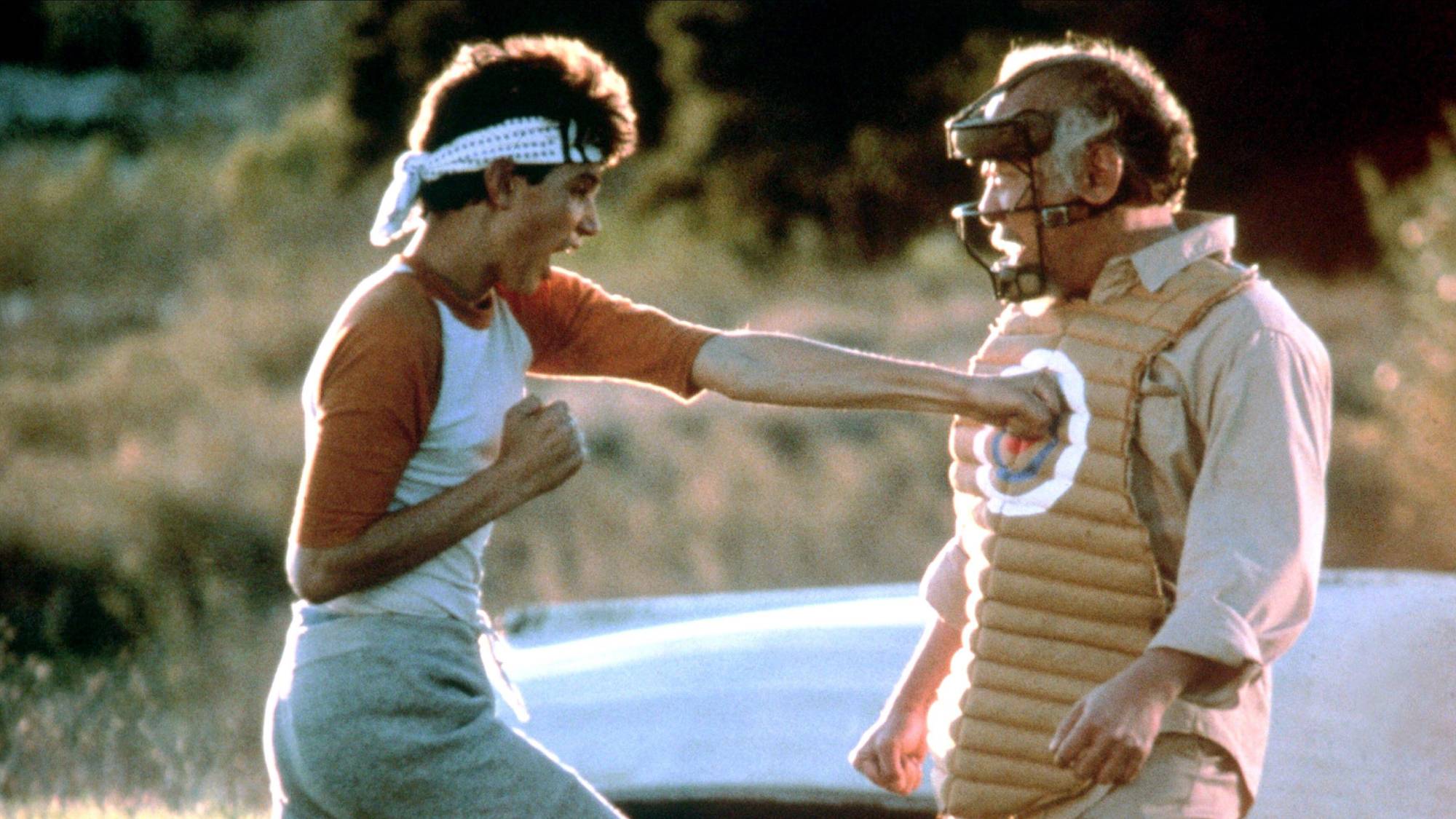 (L-R) Ralph Macchio as Daniel LaRusso and Pat Morita as Mr. Miyagi in "The Karate Kid"