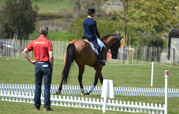 Michael Jung riding La Biosthetique - Sam FBW GER - warming up for dressage with Chris Bartle - during the Dressage Phase of The Mitsubishi Motors Badminton Horse Trials at Badminton in Gloucestershire, UK on 5th May 2016