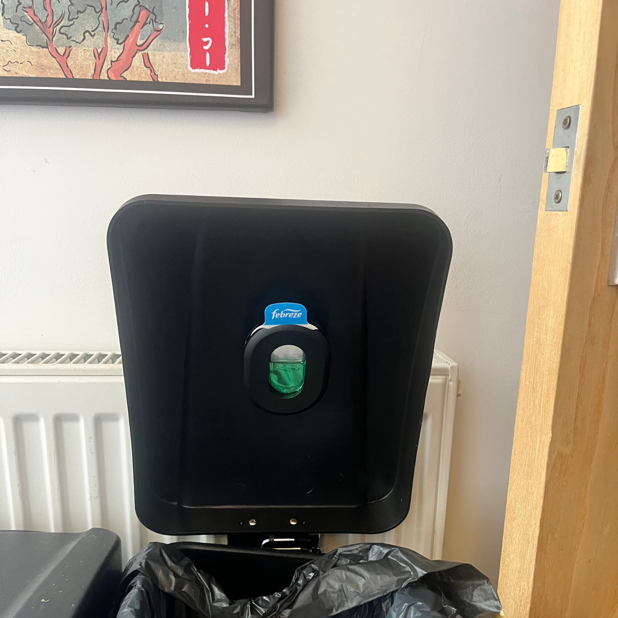 Febreze bin freshener on a kitchen bin.