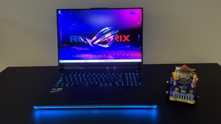 Asus ROG Strix Scar 18 gaming laptop open on a black table