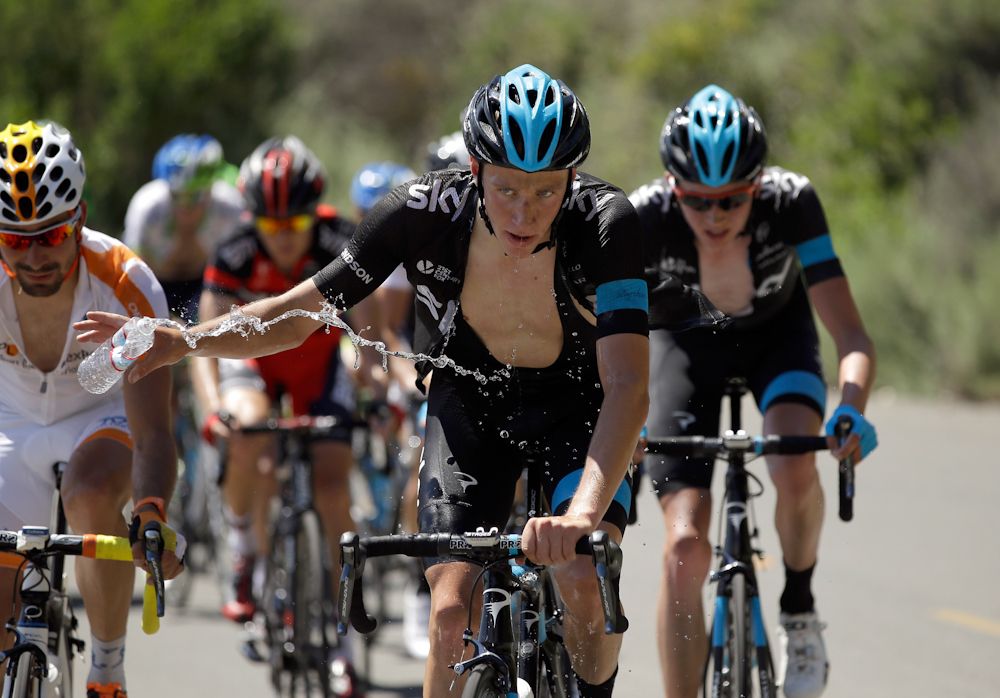Josh Edmondson of Great Britain riding for Team Sky tosses away a water bottle while he climbs Mount Diablo during stage three of the the 2014 Amgen Tour of California