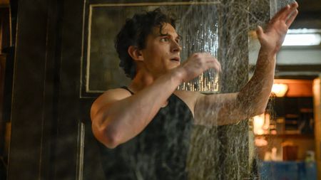 Peter Parker (Tom Holland) looks at webs in Spider-Man: Brand New Day.