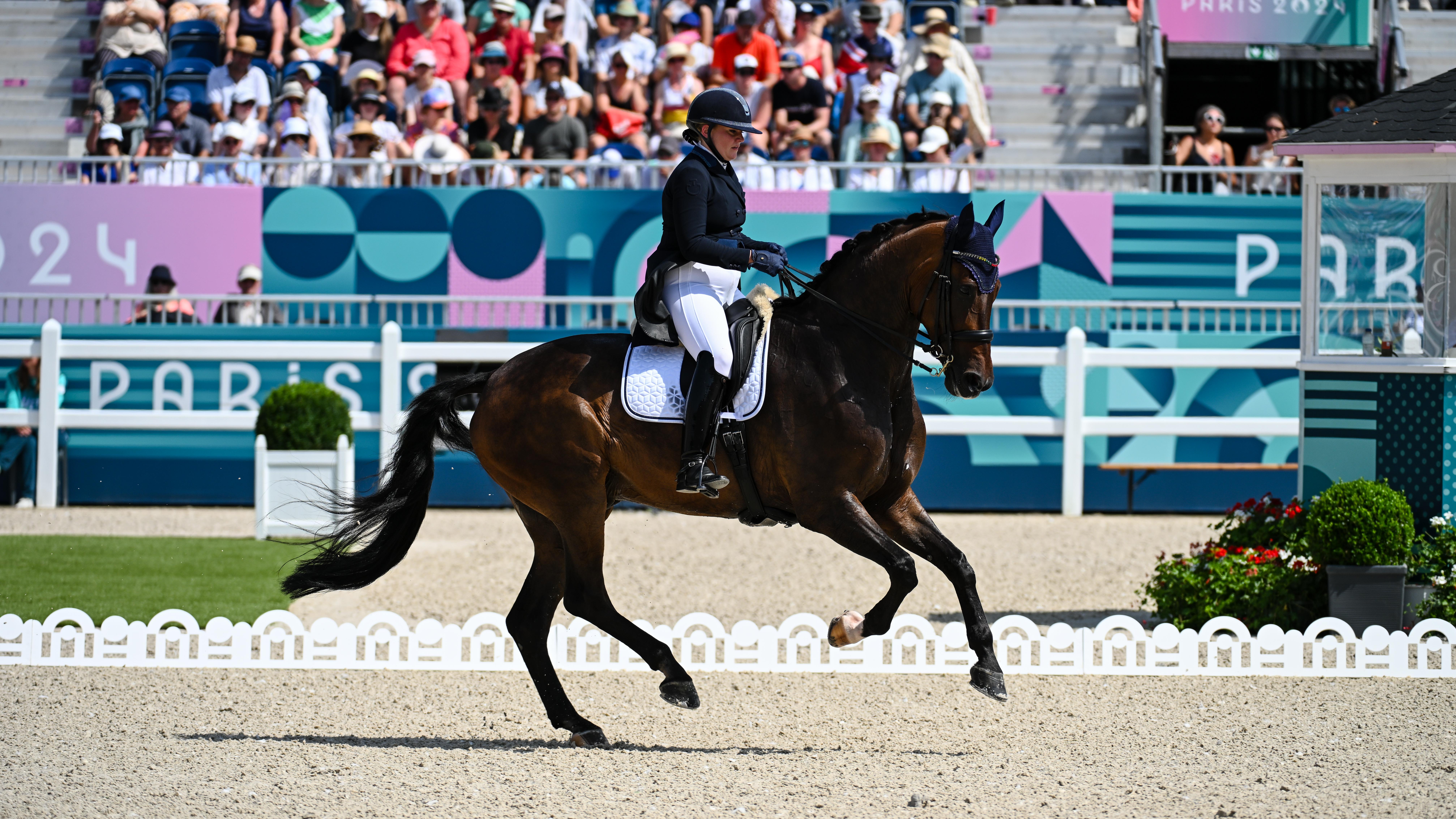 Pictured Lithuanian dressage rider Justina Vanagaite competing at the Paris Olympics
