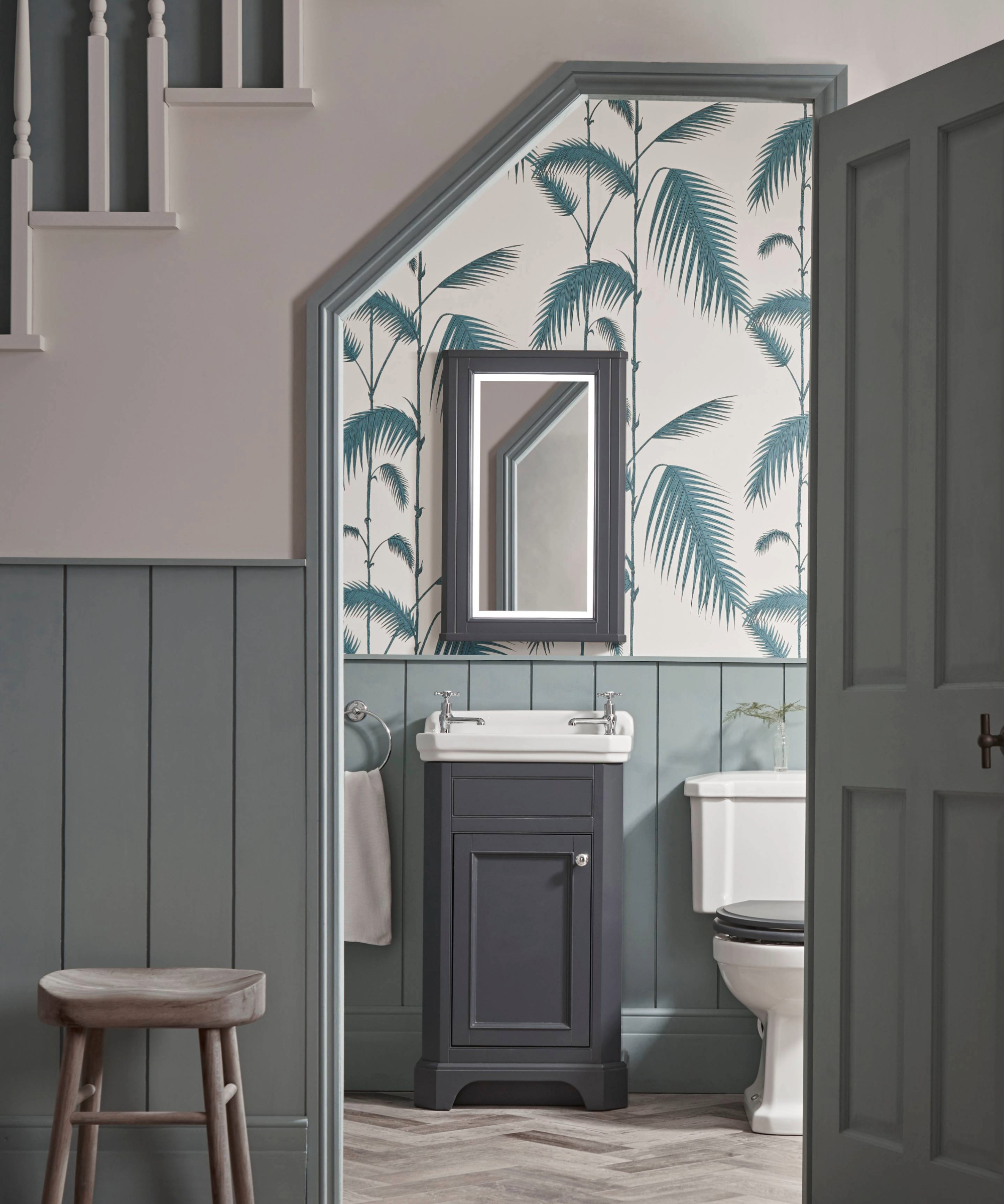 Understairs toilet idea with half wallpaper, half paneling