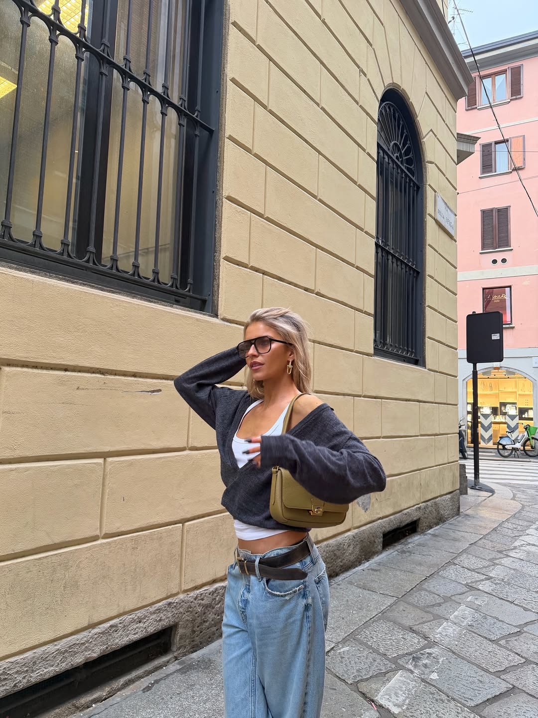 woman wearing gray sweater spring outfit 2026