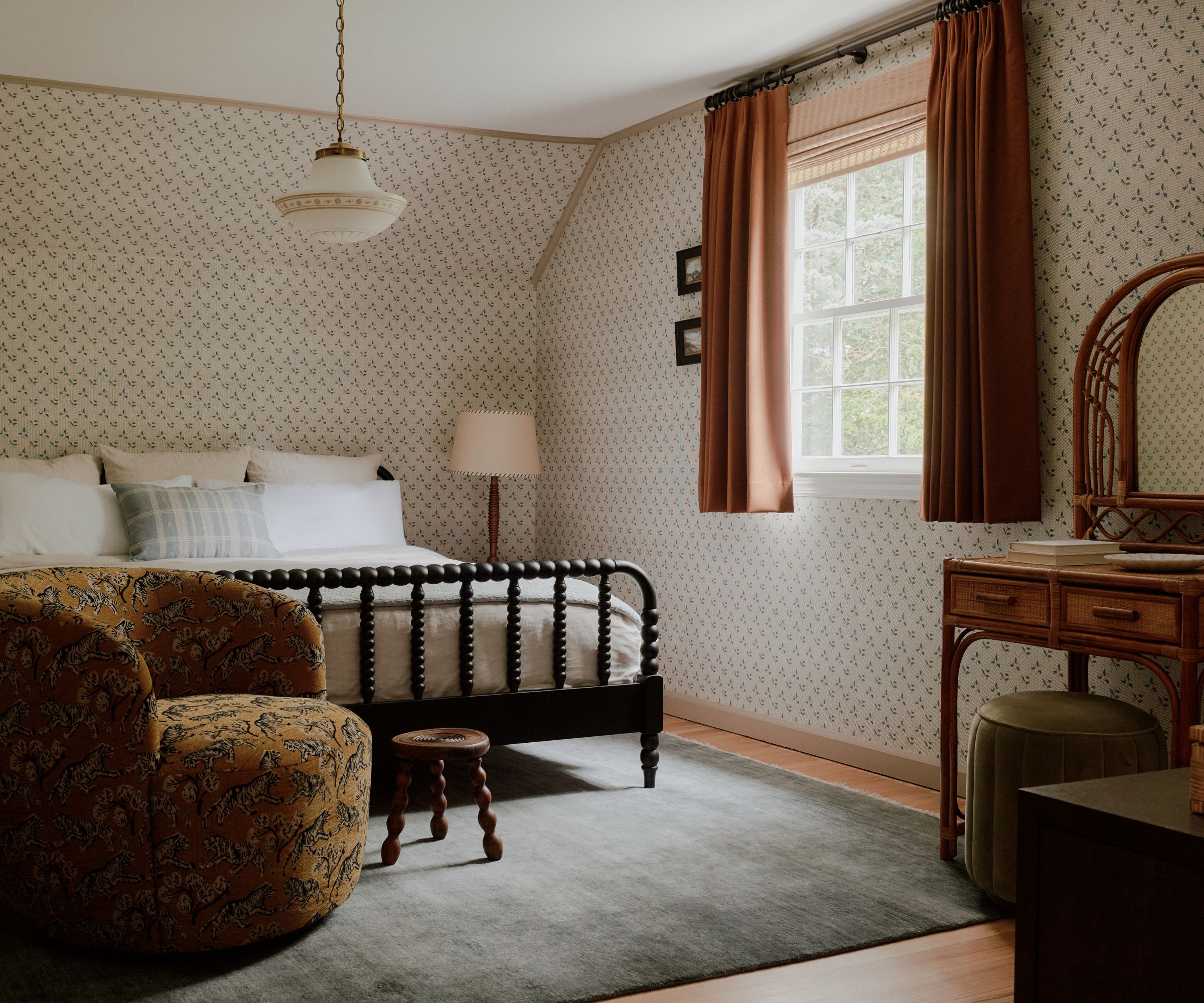 bedroom with bobbin bed floral wallpaper