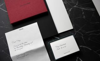 Box fresh Prada’s invitation featuring a hand-written note in a Prada headed letter.