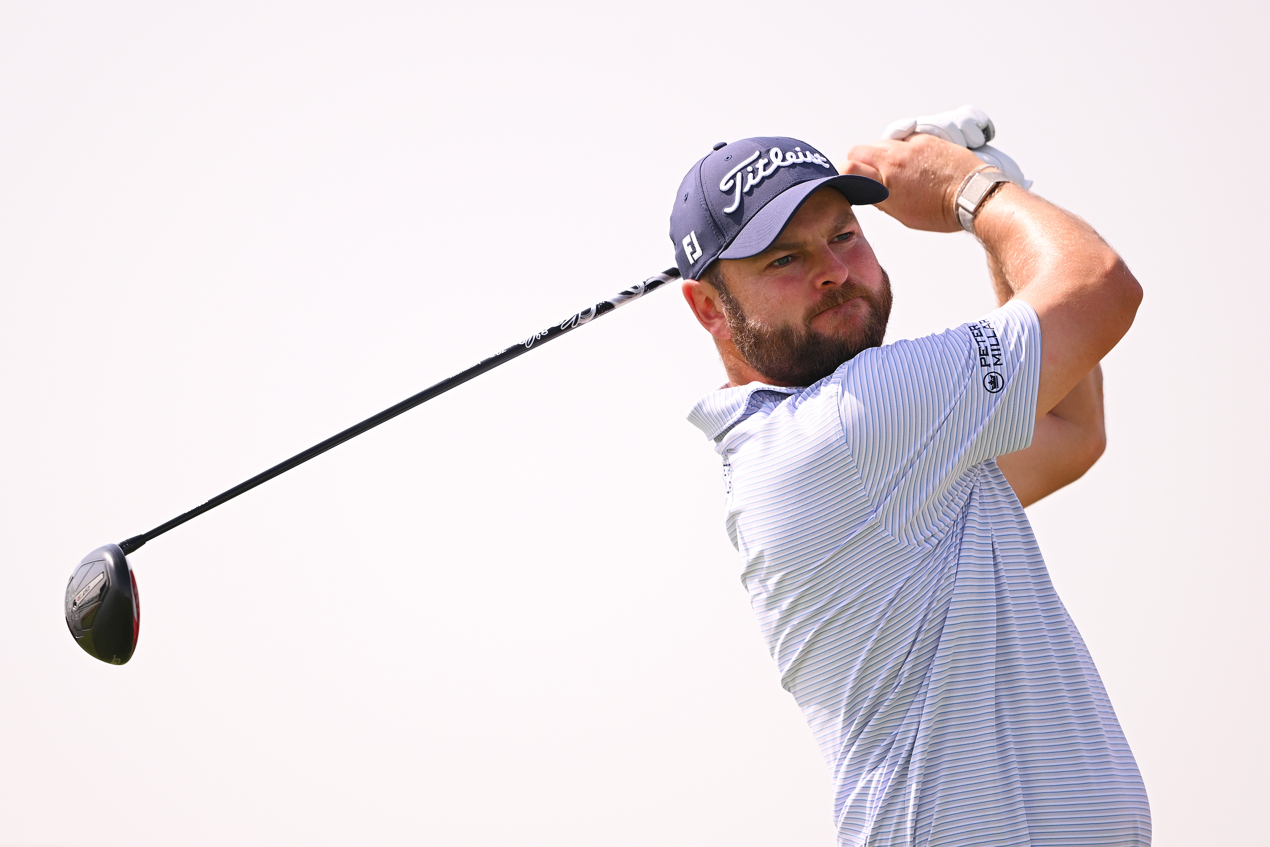 Jordan Smith hits a driver off the tee