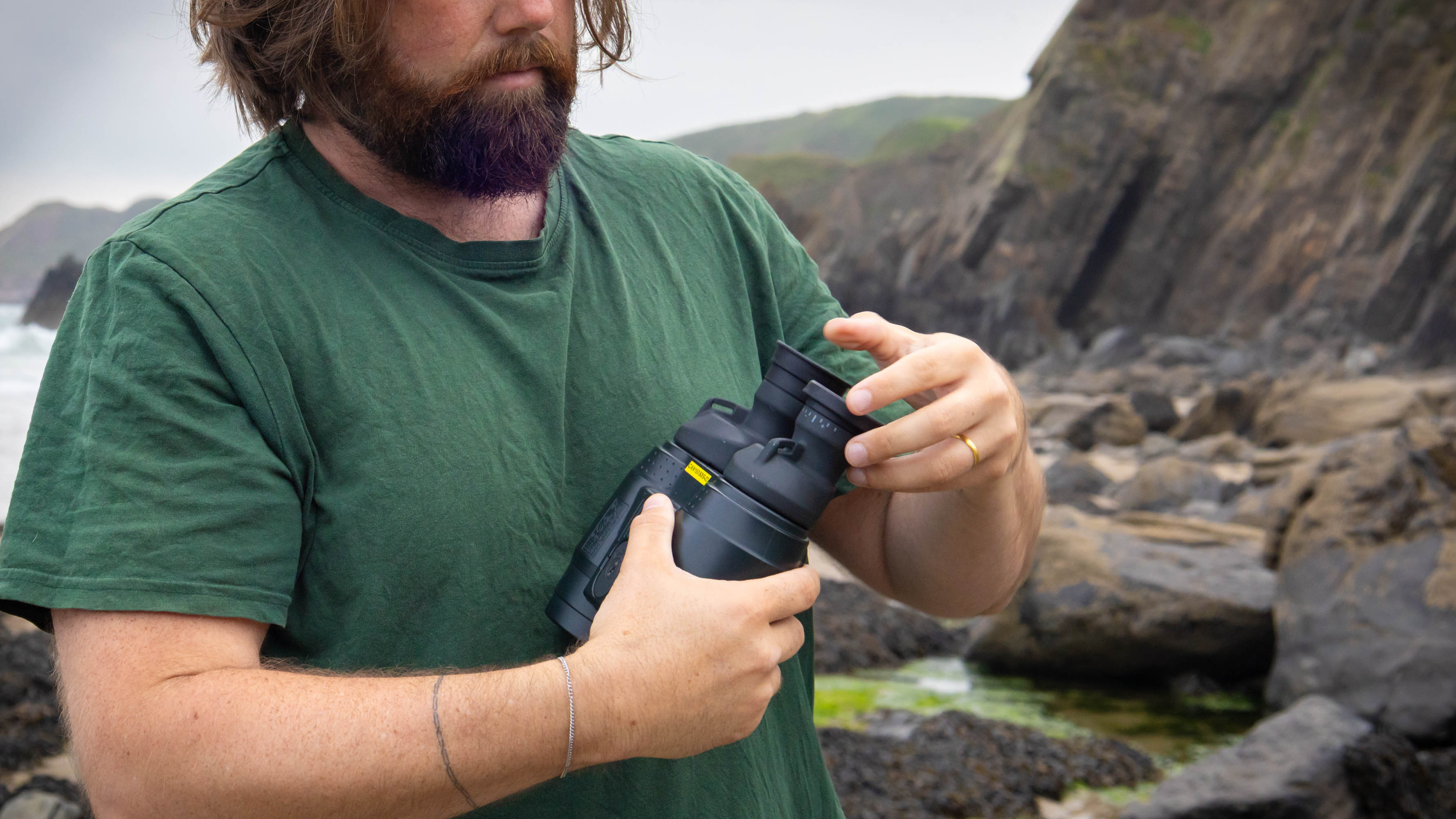 The eyecups and strap holders on the Canon 15x50 IS binoculars.