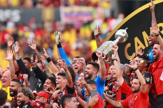Flamengo players celebrate with the trophy after beating Athletico Paranaense in the final of the Copa Libertadores in October 2022.