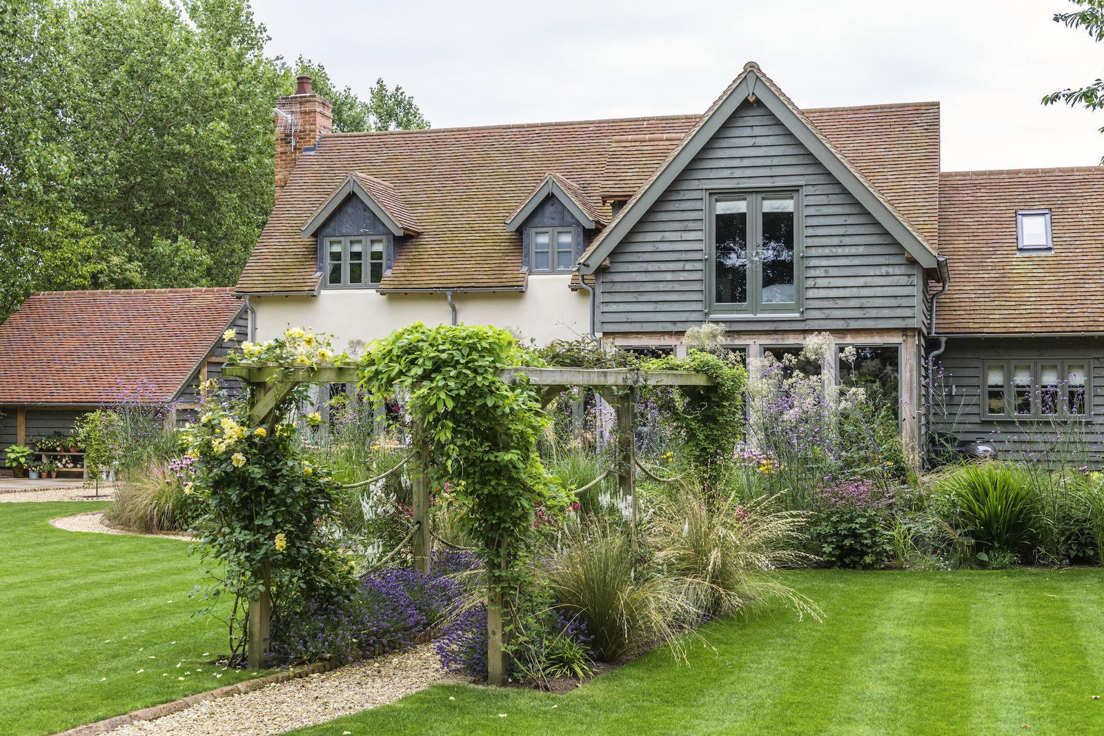 This oak frame house has views on to a pretty garden and pond | Homes ...