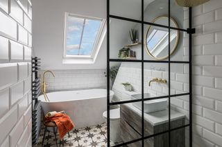 a loft conversion bathroom with a roof light