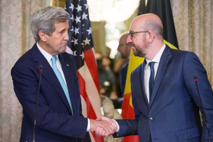 John Kerry shakes hands with Belgian Prime Minister Charles Michel