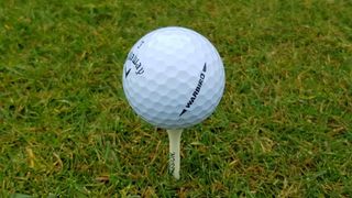 Callaway Warbird golf ball teed up showing off its handy alignment line