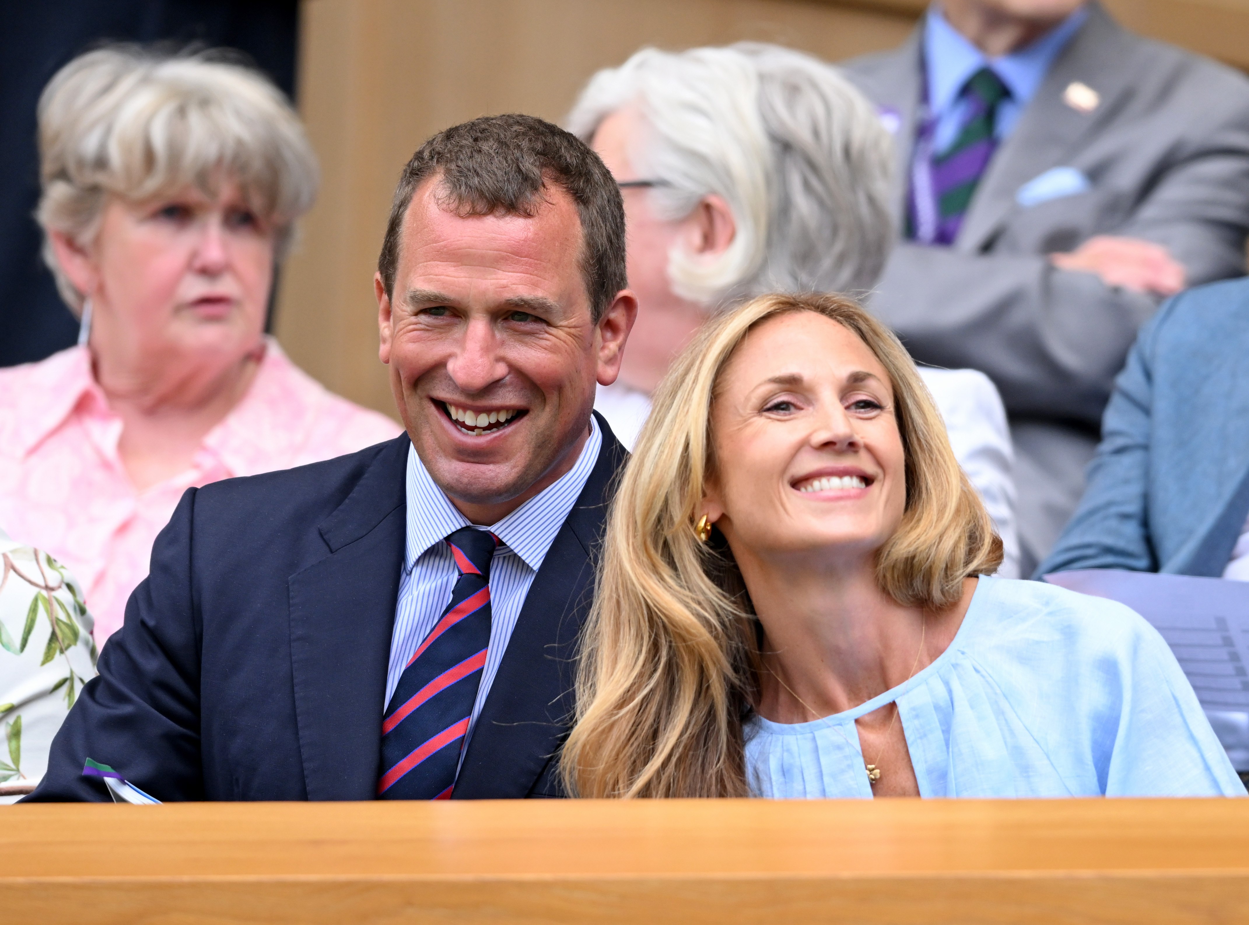 Peter Phillips and Harriet Sperling smiling at Wimbledon wearing shirts