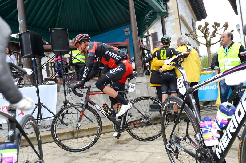 Peter Velits riding off from sign on