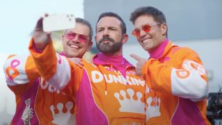 Matt Damon, Ben Affleck, and Tom Brady taking a selfie in Dunkin' ad