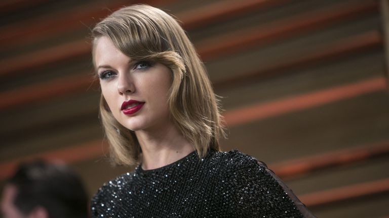 Taylor Swift wearing black glitter evening gown