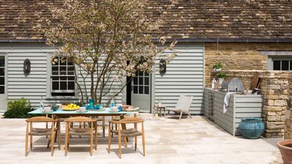 how much does an outdoor kitchen cost outdoor kitchen with Big Green BBQ, tiled walls, storage, shelves, condiments, glassware, low table, storage for cutlery, compost, logs