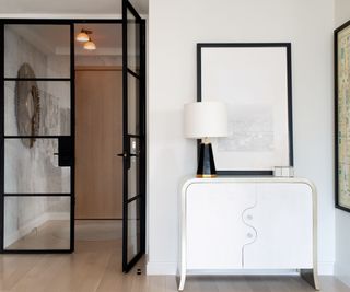 Monochrome entryways with white console table