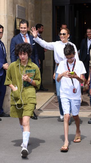 Jennifer Lopez, Emme Anthony and Max Anthony are seen leaving the Crillon hotel on July 27, 2022 in Paris, France.