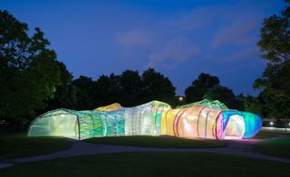 The structure's bright colours come alive at night, when lit from within