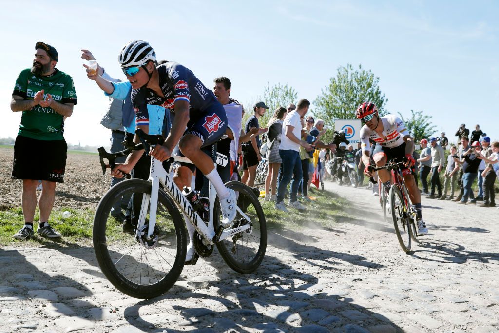 ROUBAIX FRANCE APRIL 17 Mathieu Van Der Poel of Netherlands and Team AlpecinFenix and Jasper Stuyven of Belgium and Team Trek Segafredo compete passing through a cobblestones sector during the 119th ParisRoubaix 2022 Mens Elite a 2572km one day race from Compigne to Roubaix ParisRoubaix WorldTour on April 17 2022 in Roubaix France Photo by Bas CzerwinskiGetty Images