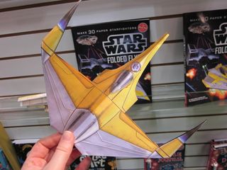 Fold your own Millenium Falcon with this new Star Wars Folder Flyers paper airplane kit from Klutz.