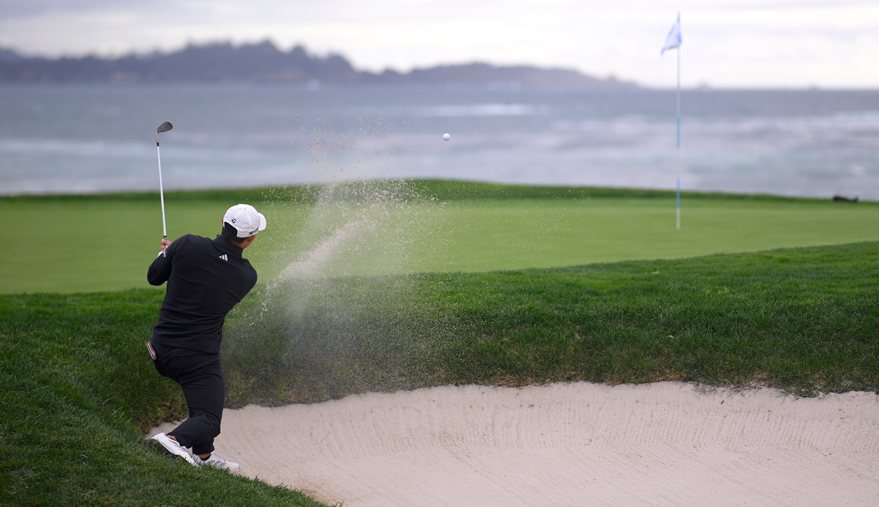 Collin Morikawa hits a bunker shot