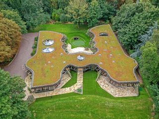 A birdseye view of the house showing the green sedum roof