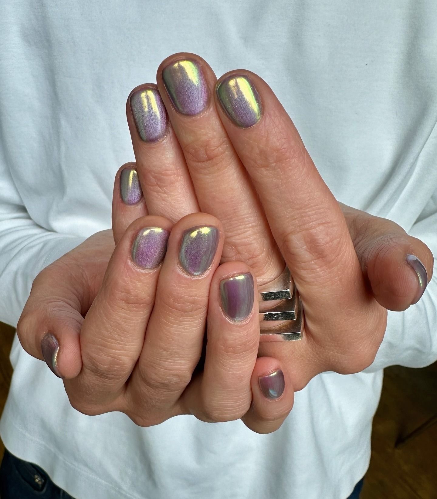 Holographic purple and green chrome nails