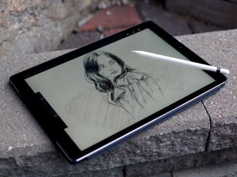 Procreate on iPad Pro with an illustration of Jessica Jones and an Apple Pencil resting on top