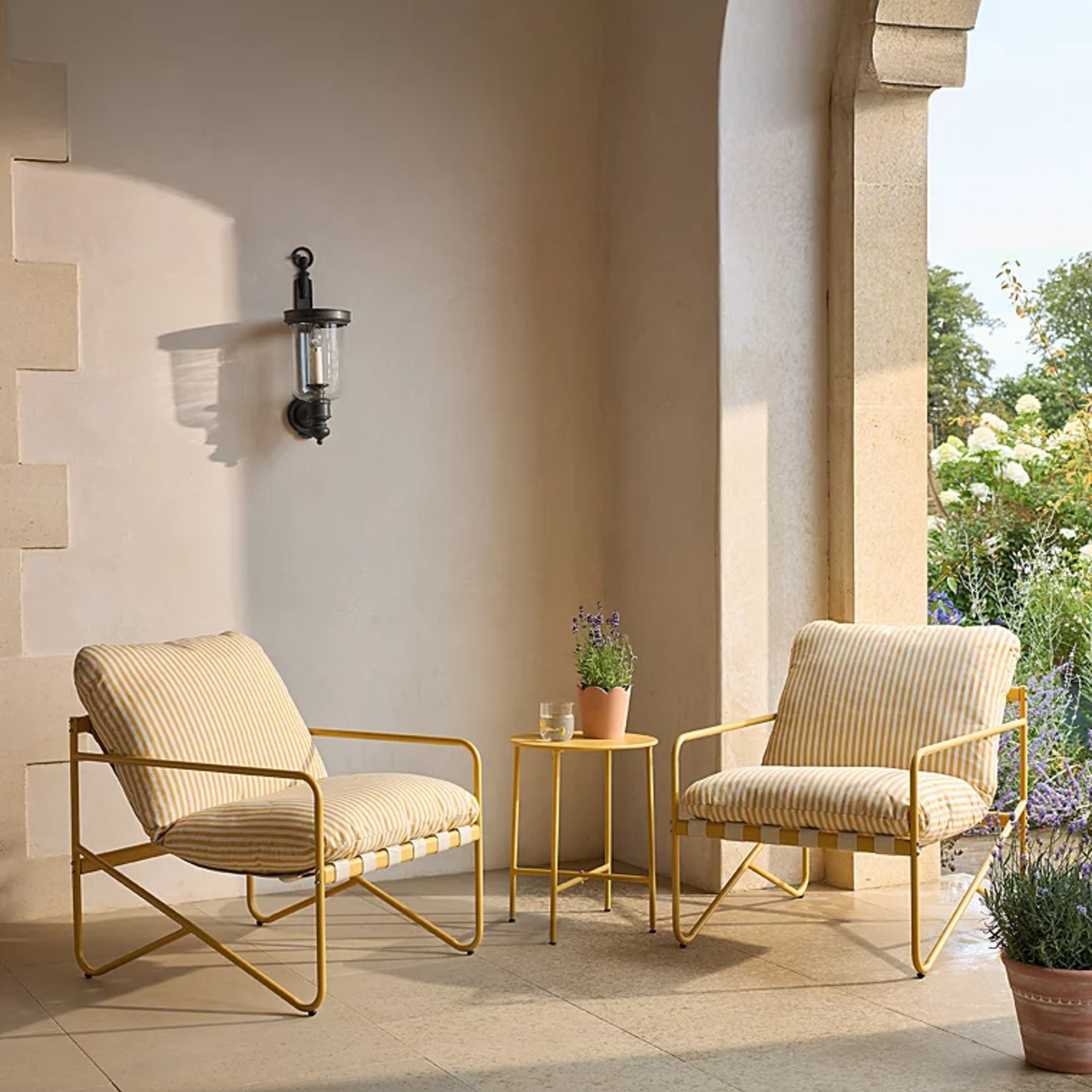 George Home Tuscany Yellow 3 Piece Garden Bistro Set in and indoor-outdoor area adjacent to the garden