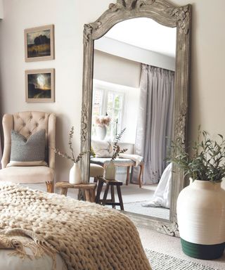 Grey mirror, wooden table, white pots