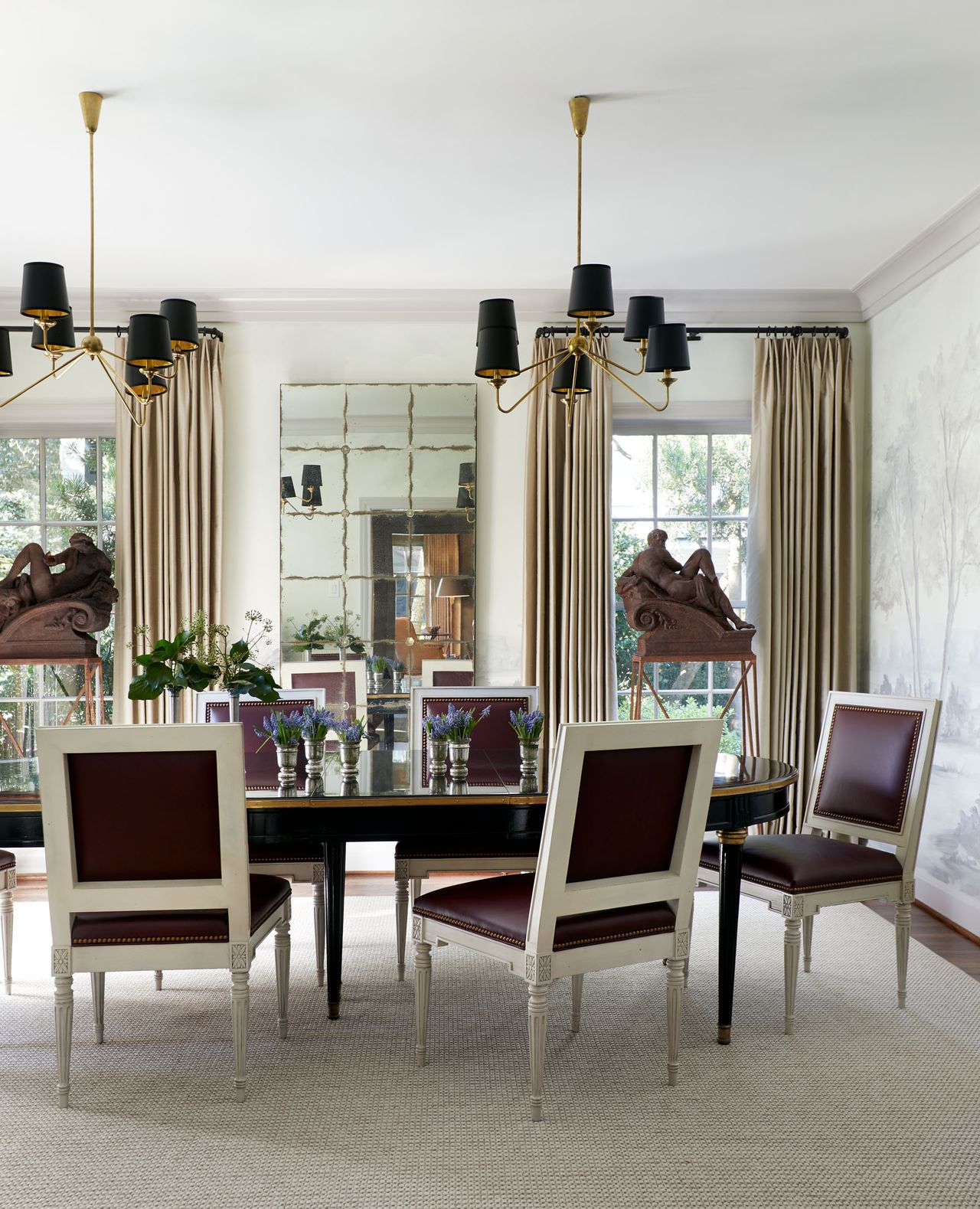 Round wooden table, white and purple leather chairs