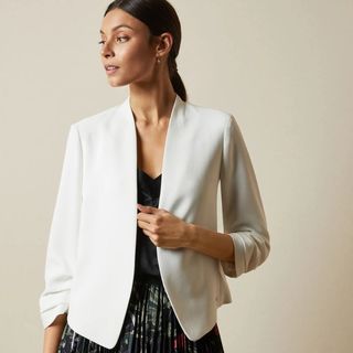 woman in a white jacket